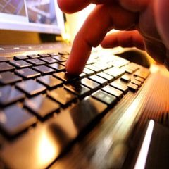 farmer accessing online controls